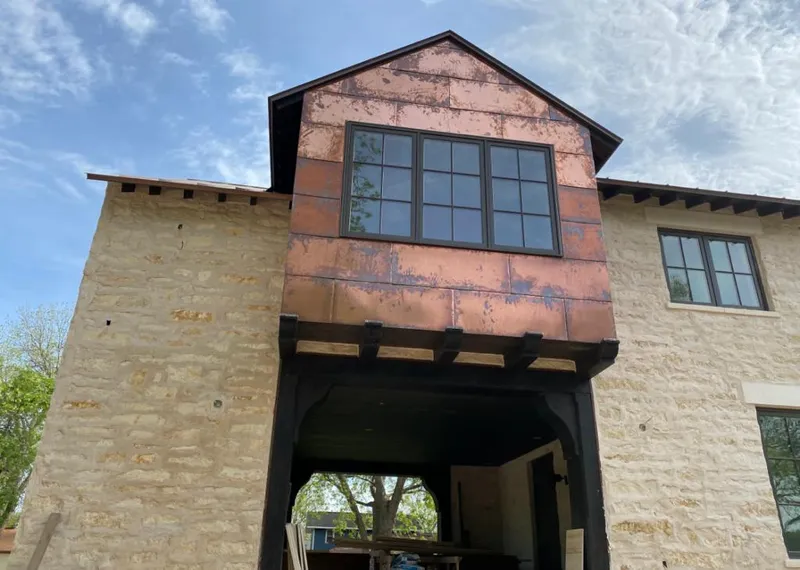 Copper metal panel facade on a stone building for Metal Roof Coating in Simi Valley