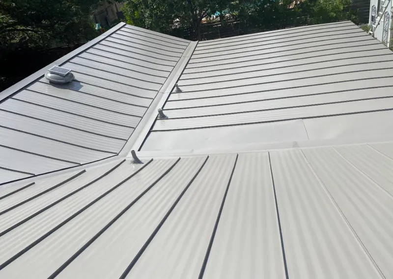 Solar attic fan installed on a metal roof for Roof Ventilation in Simi Valley
